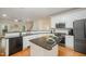 Modern kitchen features granite countertops, stainless steel appliances, and ample cabinet space at 1208 Dunn Creek Xing, Wake Forest, NC 27587