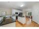 Bright kitchen boasts hardwood floors, a center island, and views into the adjacent dining area at 1208 Dunn Creek Xing, Wake Forest, NC 27587