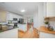 Spacious kitchen with white cabinetry, granite countertops, and a seamless flow to the dining area at 1208 Dunn Creek Xing, Wake Forest, NC 27587