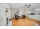 Open living area featuring beautiful hardwood floors, fireplace, and a partial view of the kitchen at 1208 Dunn Creek Xing, Wake Forest, NC 27587