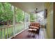 Inviting screened porch with comfortable seating and ceiling fan, ideal for relaxation at 1208 Dunn Creek Xing, Wake Forest, NC 27587