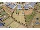 Large fenced yard with a shed; aerial view of neighborhood highlighting proximity to other homes and shared spaces at 123 Gunderson Ln, Garner, NC 27529