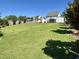 Spacious lawn in the back yard with landscaped border at 123 Gunderson Ln, Garner, NC 27529