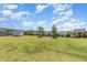 Expansive backyard featuring a lush lawn, well-manicured trees, and a charming storage shed at 123 Gunderson Ln, Garner, NC 27529