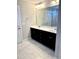 Spacious bathroom features a double vanity with dark cabinets and a large mirror at 123 Gunderson Ln, Garner, NC 27529