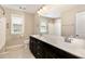 Bathroom with double vanity, large mirror and tiled floors at 123 Gunderson Ln, Garner, NC 27529