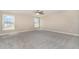 Large bedroom with two windows and carpeted floors at 123 Gunderson Ln, Garner, NC 27529