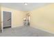 Neutral bedroom with carpeted floor and view into hallway at 123 Gunderson Ln, Garner, NC 27529