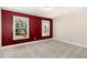 Bedroom with red accent wall and carpeted floors at 123 Gunderson Ln, Garner, NC 27529