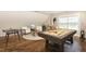 Finished game room features a pool table, foosball, and seating area, perfect for entertaining at 123 Gunderson Ln, Garner, NC 27529