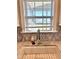 Well-lit kitchen sink with a chrome faucet and an eye-catching mosaic backsplash under a window with natural light at 123 Gunderson Ln, Garner, NC 27529
