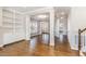 Spacious living room featuring hardwood floors, built-in shelving, and bright lighting at 123 Gunderson Ln, Garner, NC 27529