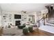 Staged living room with built-in shelving and fireplace provides a cozy gathering space at 123 Gunderson Ln, Garner, NC 27529