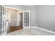 Office featuring a plush carpet and glass panel doors leading to other rooms at 123 Gunderson Ln, Garner, NC 27529