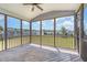 Screened porch features wooden floors, ceiling fan and fenced yard view at 123 Gunderson Ln, Garner, NC 27529