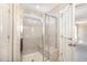 Modern bathroom shower features glass doors, light tile, and a built-in bench at 123 Gunderson Ln, Garner, NC 27529
