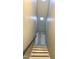 Stairway with skylight features carpeted stairs and painted risers at 123 Gunderson Ln, Garner, NC 27529