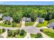 An aerial view of a home nestled in a lush green neighborhood, showcasing its well-manicured lawn and charming curb appeal at 123 Holiday Island Dr, Garner, NC 27529