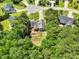Stunning aerial view of a home nestled among lush greenery in a desirable neighborhood at 123 Holiday Island Dr, Garner, NC 27529