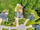 An overhead shot displays a home's well-maintained lawn and landscaping, situated on a tree-lined street in a lovely neighborhood at 123 Holiday Island Dr, Garner, NC 27529