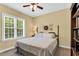 Comfortable bedroom with natural light, classic furniture, and neutral decor at 123 Holiday Island Dr, Garner, NC 27529