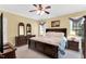 Well-lit bedroom with neutral walls, ceiling fan, and large bed at 123 Holiday Island Dr, Garner, NC 27529