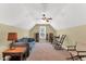 Spacious bonus room with a couch, rocking chair and natural light from the window, ideal for a rec room at 123 Holiday Island Dr, Garner, NC 27529