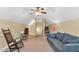 Large bonus room with ample space, a sectional sofa, and versatile seating arrangements, perfect for Gathering enjoyment at 123 Holiday Island Dr, Garner, NC 27529