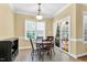 Charming breakfast nook with natural light and access to the outdoor patio at 123 Holiday Island Dr, Garner, NC 27529