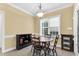 Bright breakfast nook with a round table, four chairs, and natural light from the window at 123 Holiday Island Dr, Garner, NC 27529