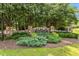 Beautiful stone entrance sign for Island Creek, surrounded by lush landscaping at 123 Holiday Island Dr, Garner, NC 27529
