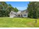 Beautifully landscaped front yard leading up to a charming single-Gathering home with a welcoming porch at 123 Holiday Island Dr, Garner, NC 27529