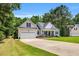 Inviting home featuring a two-car garage, manicured lawn, and charming front porch at 123 Holiday Island Dr, Garner, NC 27529