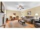 Cozy living room with hardwood floors, neutral walls, and traditional furniture at 123 Holiday Island Dr, Garner, NC 27529