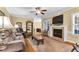 Inviting living room featuring a fireplace, hardwood floors, and comfortable seating arrangements at 123 Holiday Island Dr, Garner, NC 27529