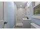 Modern bathroom featuring a walk-in shower, stylish vanity, and contemporary fixtures for a luxurious feel at 1302 Buffaloe Rd, Garner, NC 27529