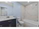 Updated bathroom with modern vanity, sleek fixtures, and a pristine shower-tub combination for a spa-like experience at 1302 Buffaloe Rd, Garner, NC 27529