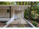 Exterior view of a covered carport with brick facade, and metal support beams at 1302 Buffaloe Rd, Garner, NC 27529