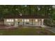 Charming single-story home with a cozy front porch and landscaped yard, nestled in a serene, wooded setting at 1302 Buffaloe Rd, Garner, NC 27529