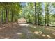 Detached two-car garage surrounded by beautiful trees at 1302 Buffaloe Rd, Garner, NC 27529