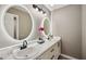 Modern bathroom featuring a double vanity, illuminated mirrors, and stylish fixtures at 131 Cricketgrass Dr, Cary, NC 27513
