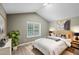 Comfortable bedroom with high ceilings, a plush bed, and natural light from the window at 131 Cricketgrass Dr, Cary, NC 27513