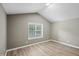 Bright, empty bedroom with a vaulted ceiling and natural light, ready for personalization at 131 Cricketgrass Dr, Cary, NC 27513