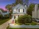 Charming two-story home features a well-maintained lawn and inviting front porch at 131 Cricketgrass Dr, Cary, NC 27513
