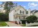 Beautiful two-story home with inviting front porch and manicured lawn at 131 Cricketgrass Dr, Cary, NC 27513