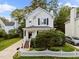Charming two-story home features a well-maintained lawn and inviting front porch at 131 Cricketgrass Dr, Cary, NC 27513