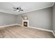 Cozy living room featuring a fireplace, perfect for relaxing and unwinding at 131 Cricketgrass Dr, Cary, NC 27513