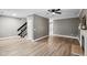 Bright living room showcasing a staircase and an open-concept layout with elegant flooring at 131 Cricketgrass Dr, Cary, NC 27513