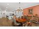Dining room with hardwood floors and decorative wallpaper at 131 English Violet Ln, Raleigh, NC 27610
