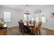 Bright dining area features hardwood floors and natural light at 131 English Violet Ln, Raleigh, NC 27610